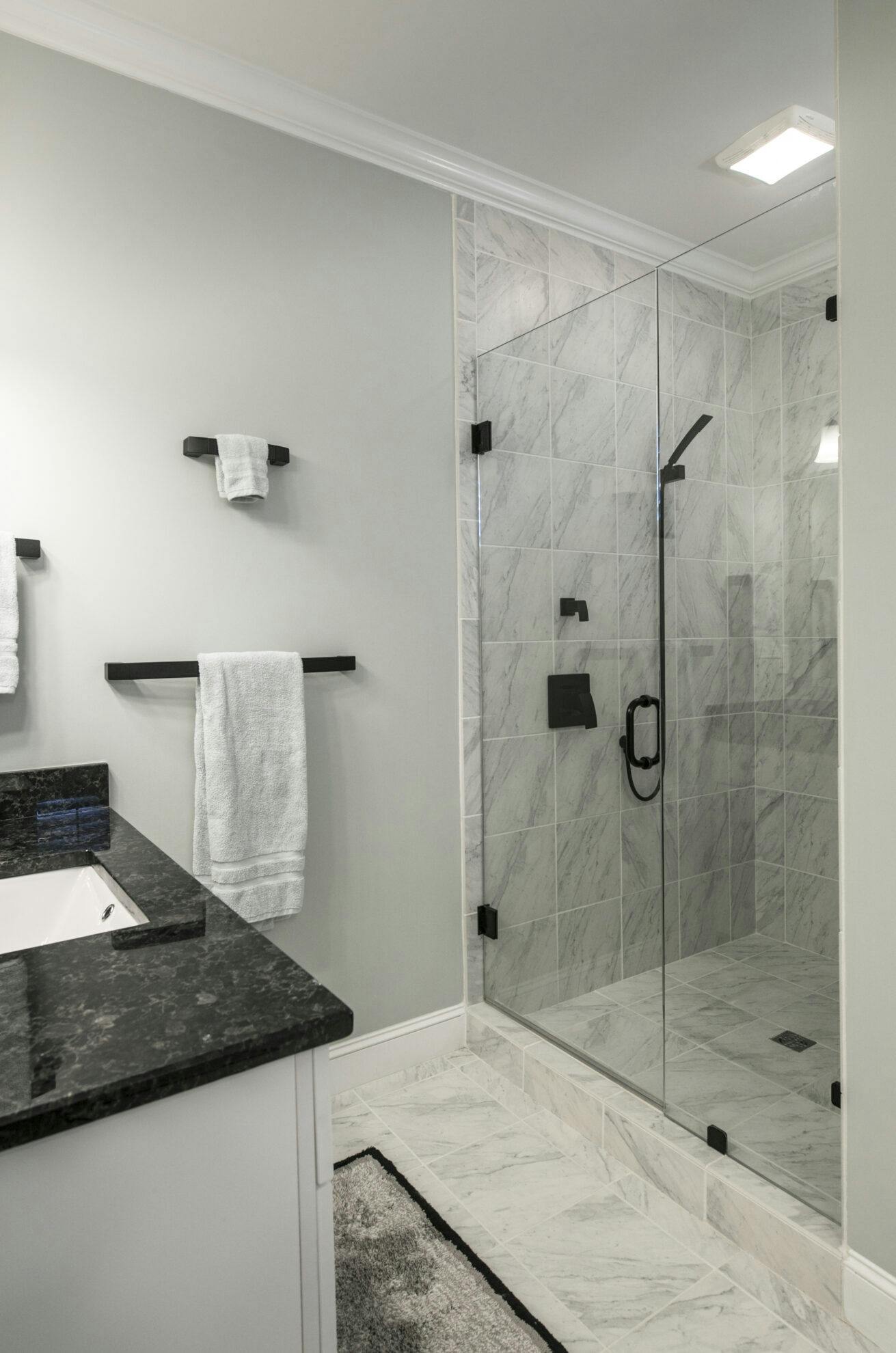 modern bathroom with glass shower and marble tile 2024 12 06 12 40 20 utc scaled.jpg?auto=compress%2Cformat&ixlib=php 3.3