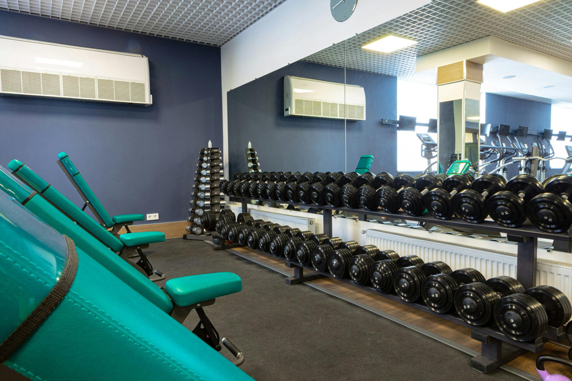 Glass Blog | new sports equipment in a gym nobody 2025 02 24 14 28 48 utc scaled.jpg?auto=compress%2Cformat&ixlib=php 3.3