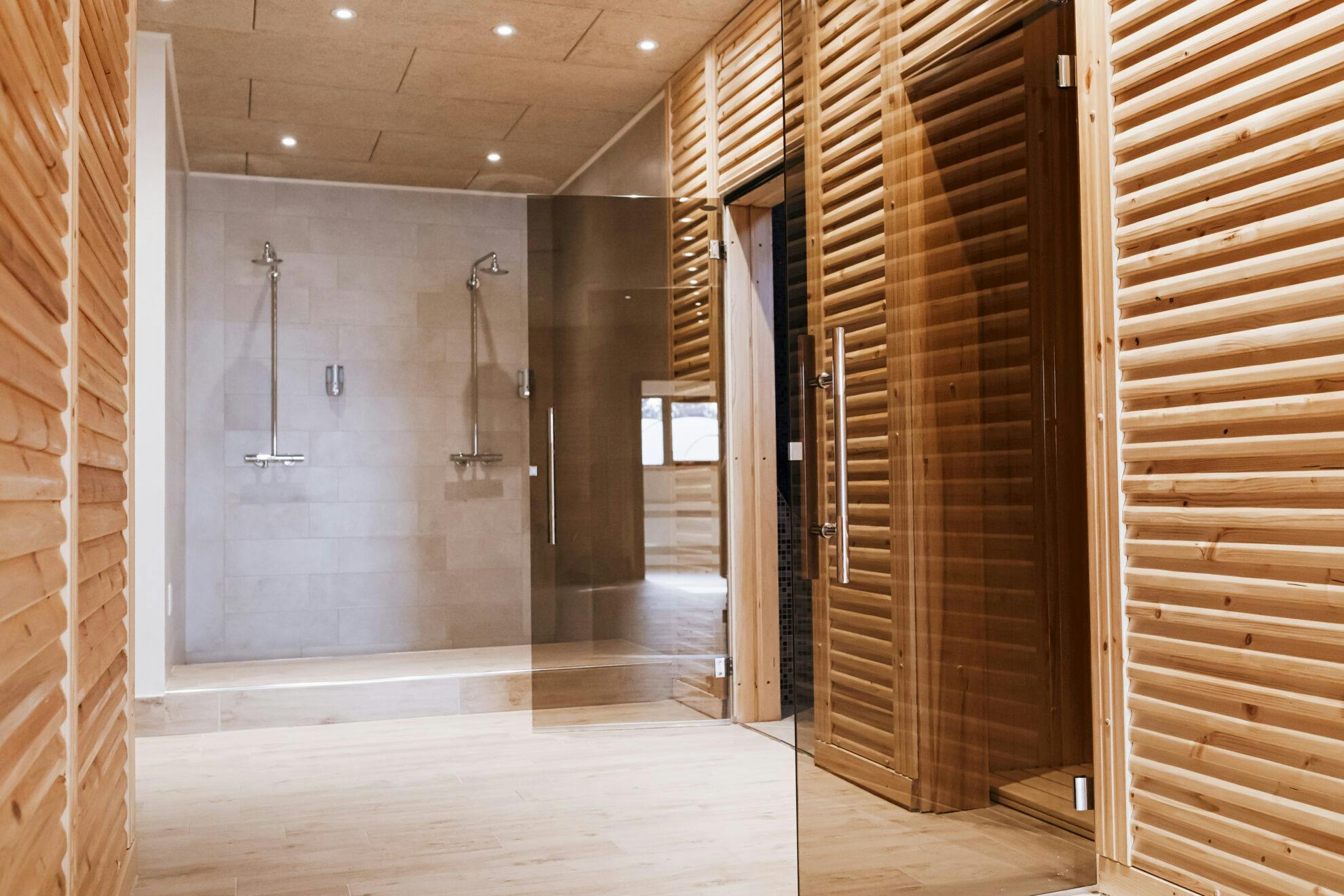 Steam Rooms &Amp; Saunas | spa resort hallway with saunas and shower 2025 03 16 05 43 21 utc scaled.jpg?auto=compress%2Cformat&ixlib=php 3.3
