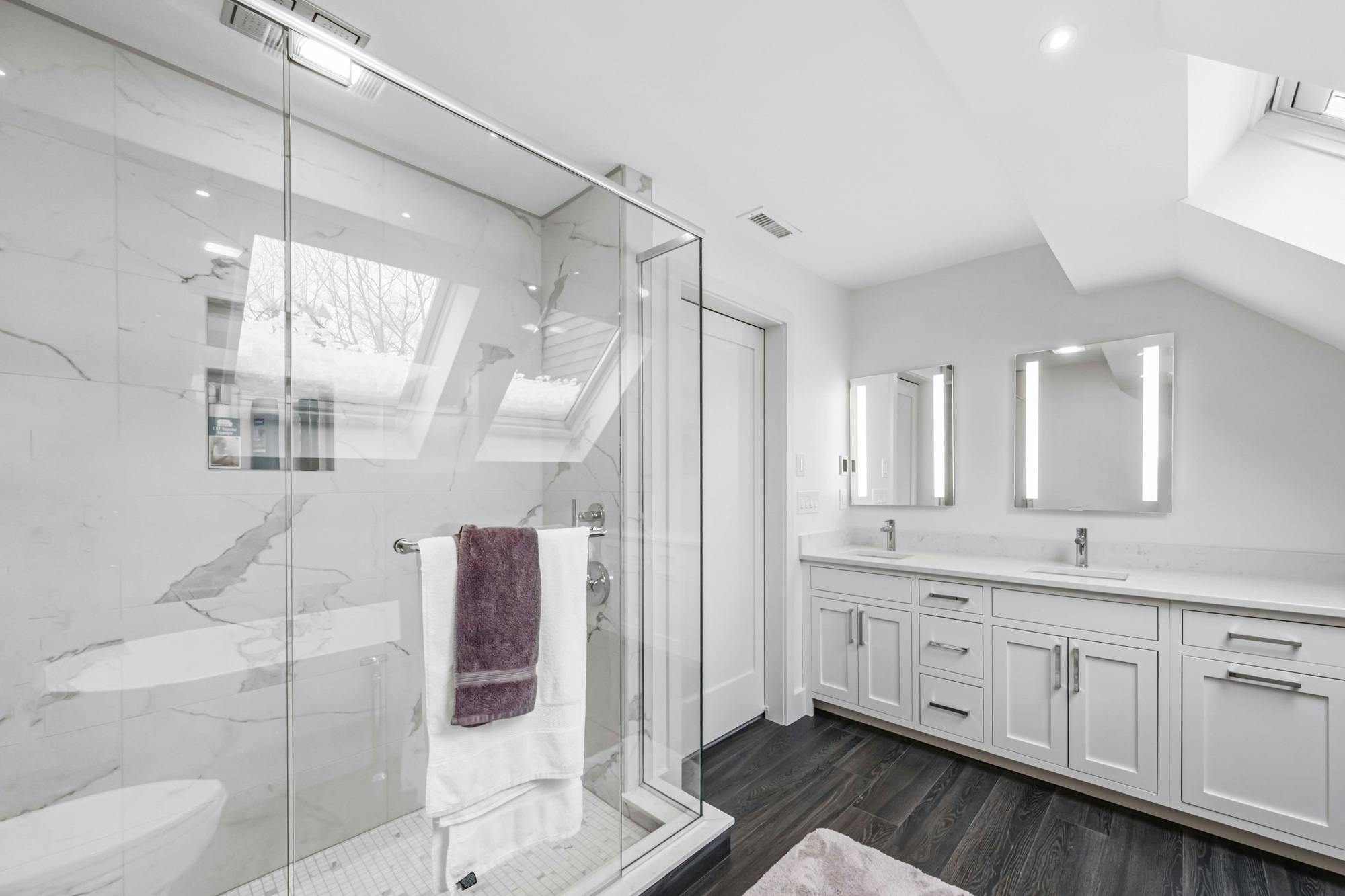 White minimalist bathroom interior with glass partition