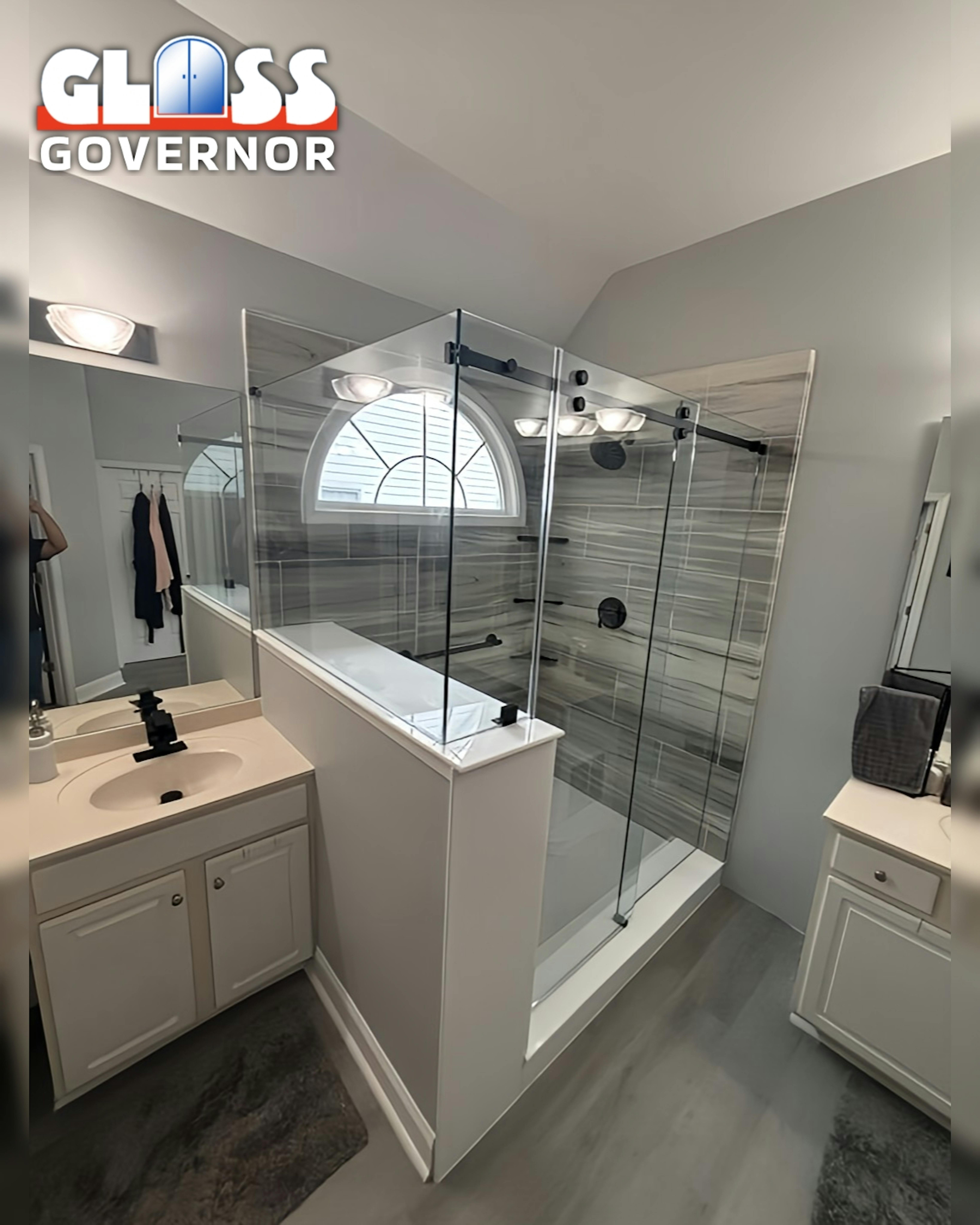 a bathroom with a glass shower and sink